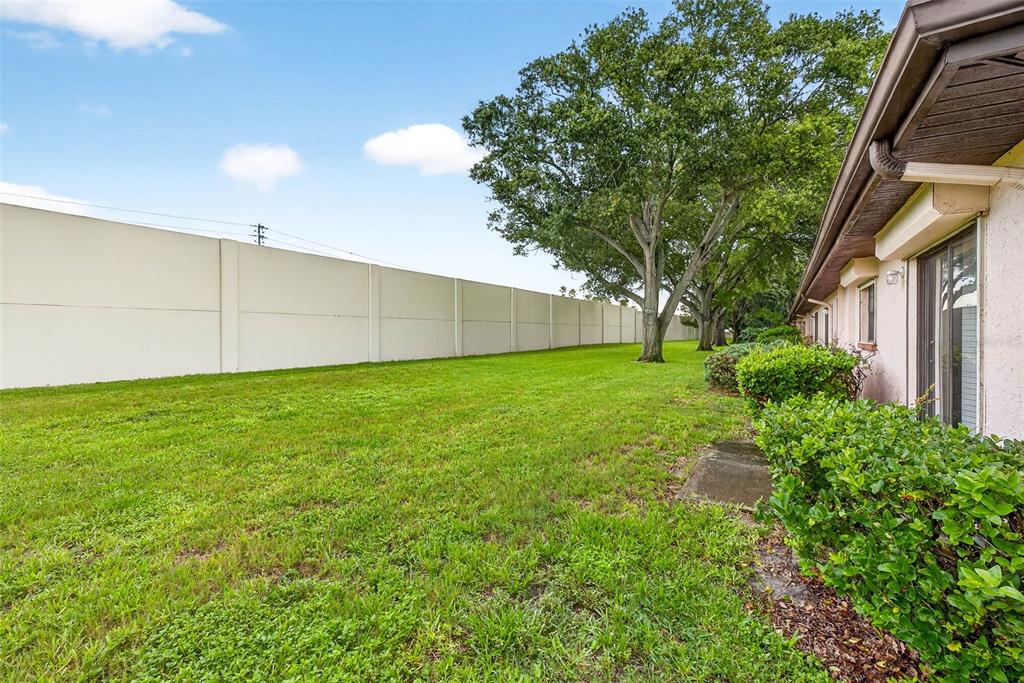 13250 Ridge Road, Unit 21 Largo, FL 33778 - Photo 34 of 36 a view of a backyard with a garden