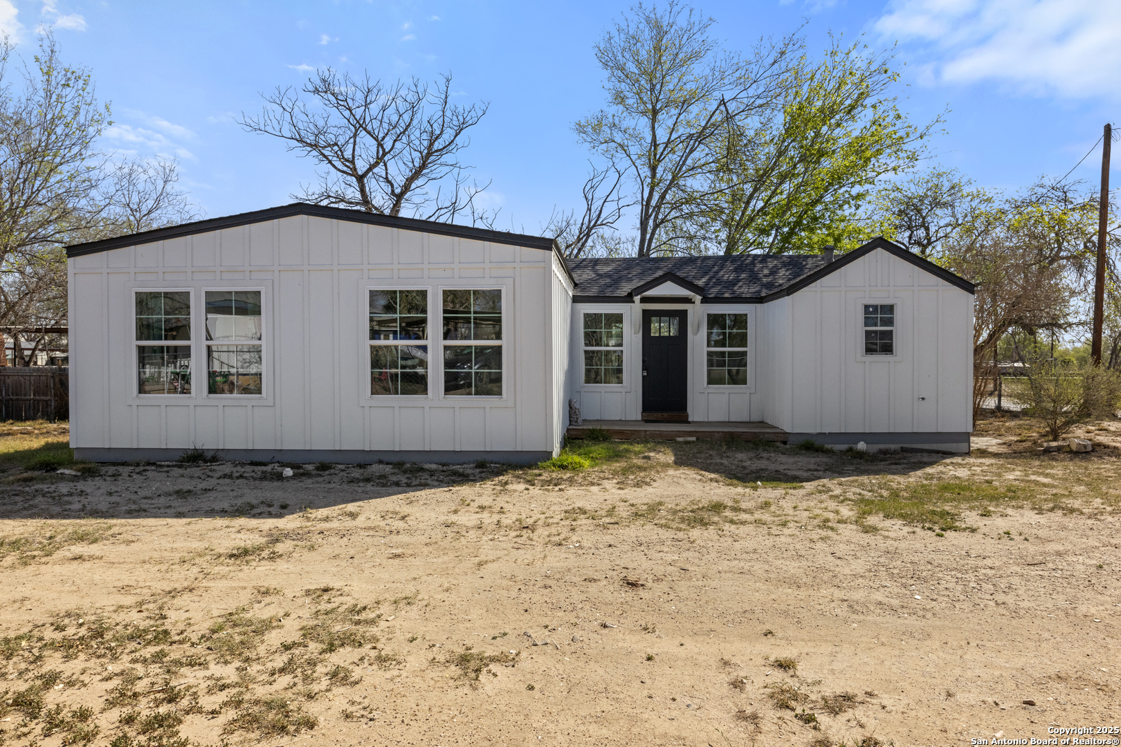 a house with trees in the background