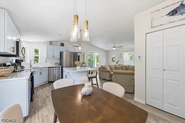 a kitchen with a sink stove and microwave