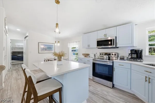 a spacious bedroom with a bed and a couch