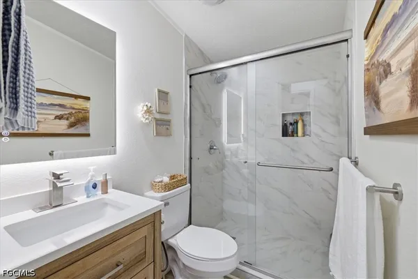 a balcony with chairs and a table