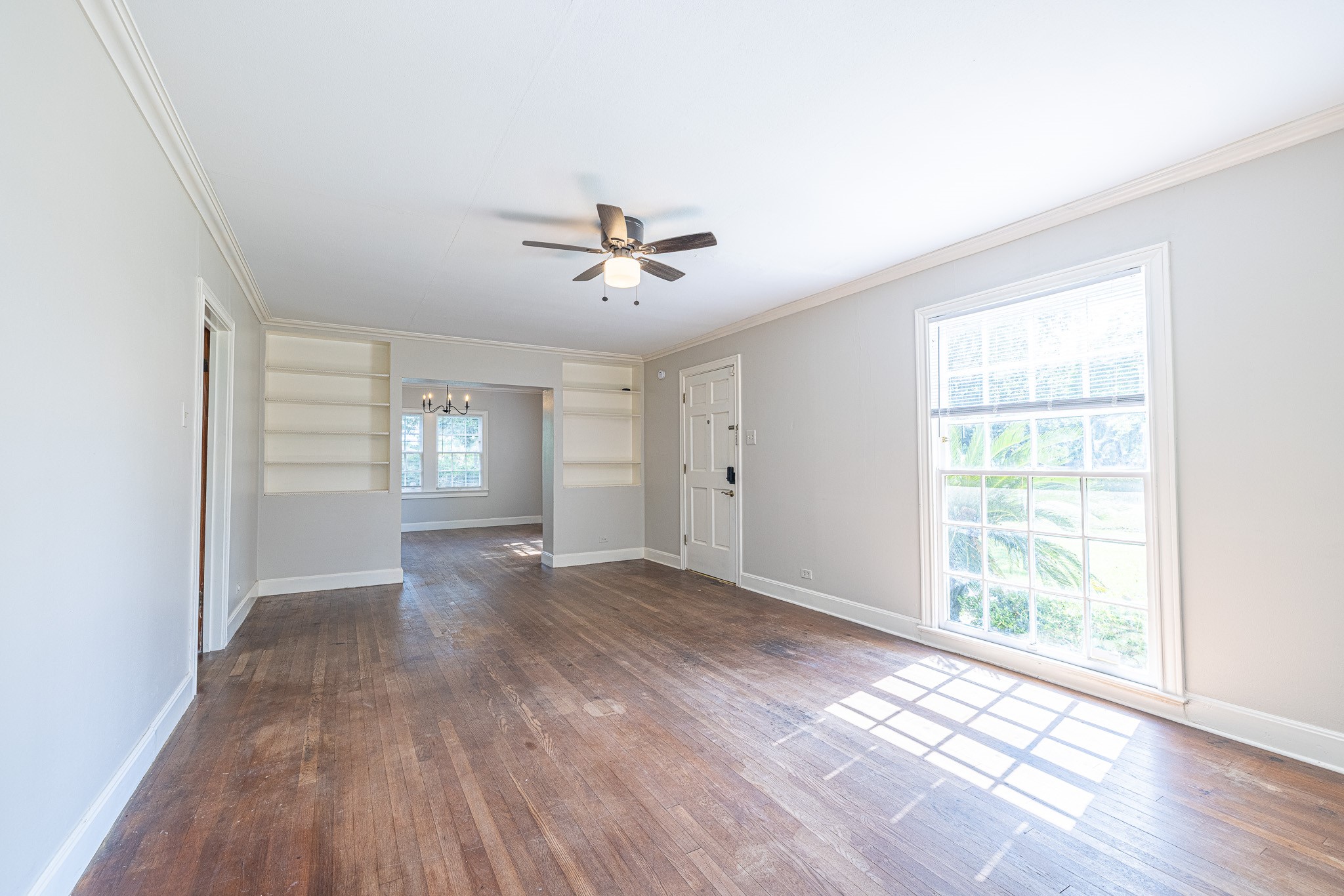 8548 Findlay Street Houston, TX 77017 - Photo 8 of 50 a view of an empty room with a window and wooden floor