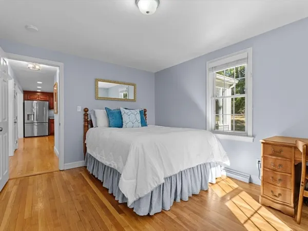 a bed room with a bed and a window