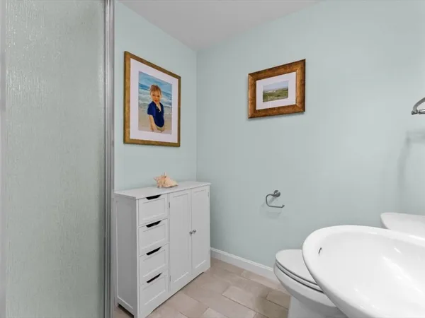 a bathroom with a bathtub and a toilet