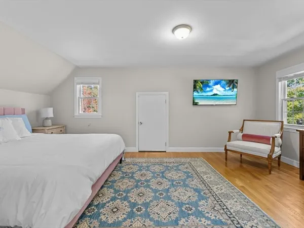 a bedroom with a bed and a desk