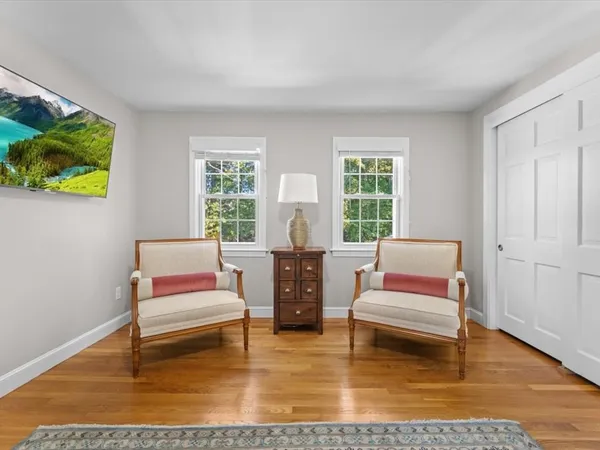 a living room with furniture and a rug