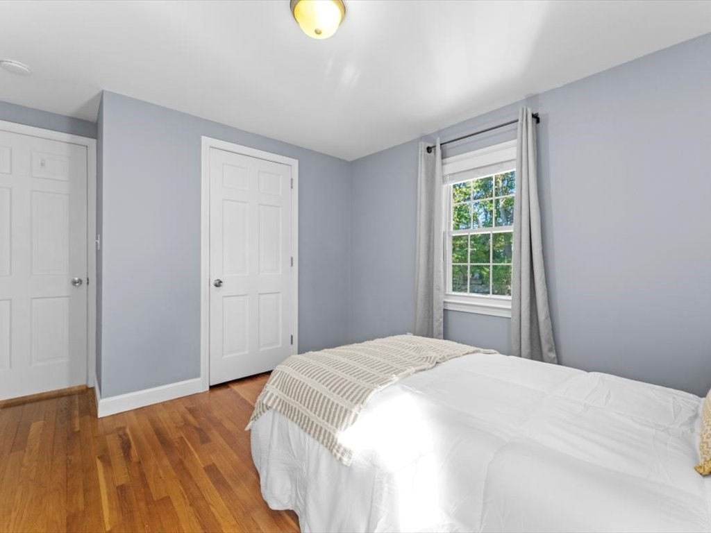 4 Huron Road Acton, MA 01720 - Photo 21 of 32 a bedroom with a bed and a window