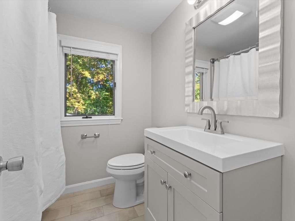 4 Huron Road Acton, MA 01720 - Photo 22 of 32 a bathroom with a sink toilet and mirror