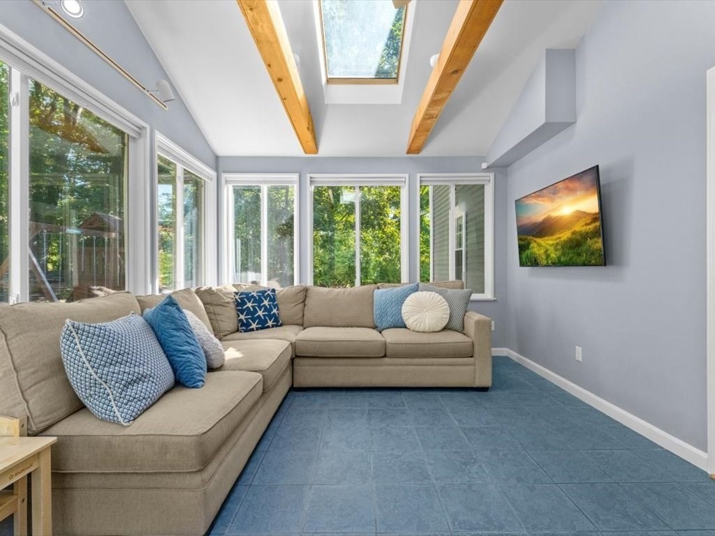4 Huron Road Acton, MA 01720 - Photo 7 of 32 a living room with furniture and a flat screen tv