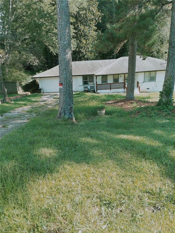 a view of house with yard