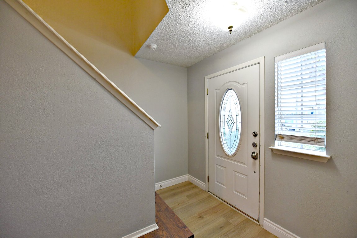 12903 Humphrey Drive Austin, TX 78729 - Photo 4 of 20 a view of a hallway with windows
