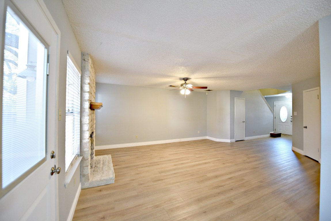 12903 Humphrey Drive Austin, TX 78729 - Photo 6 of 20 a view of empty room with wooden floor and fan
