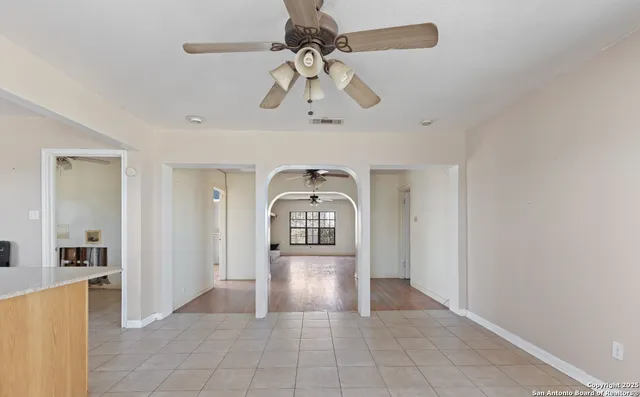 a view of a living room and chandelier