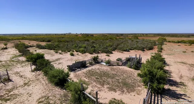 a view of a terrace with a forest