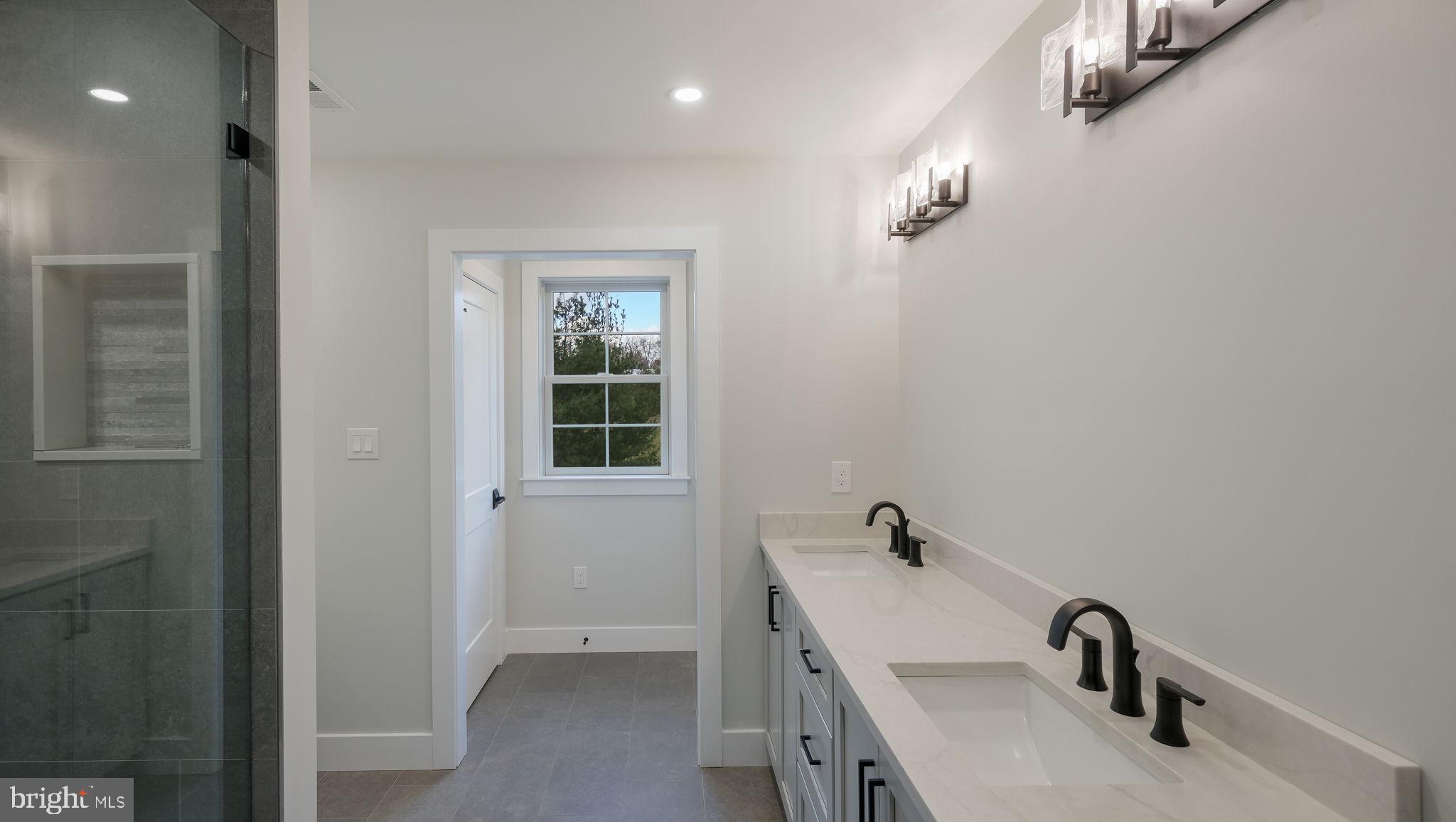 2550 Rickert Road Perkasie, PA 18944 - Photo 40 of 73 a bathroom with a sink and a mirror