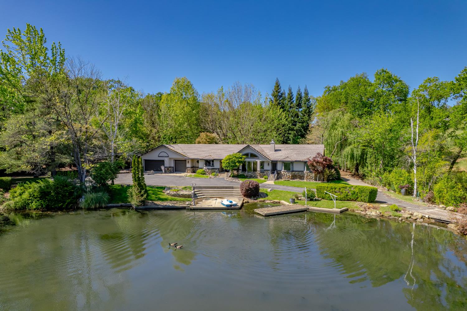 10665 Mt Vernon Road Auburn, CA 95603 - Photo 1 of 45 a view of a lake with houses