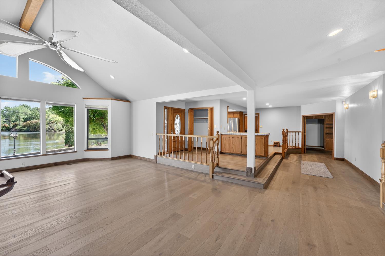 10665 Mt Vernon Road Auburn, CA 95603 - Photo 25 of 45 an empty room with wooden floor and a floor to ceiling window