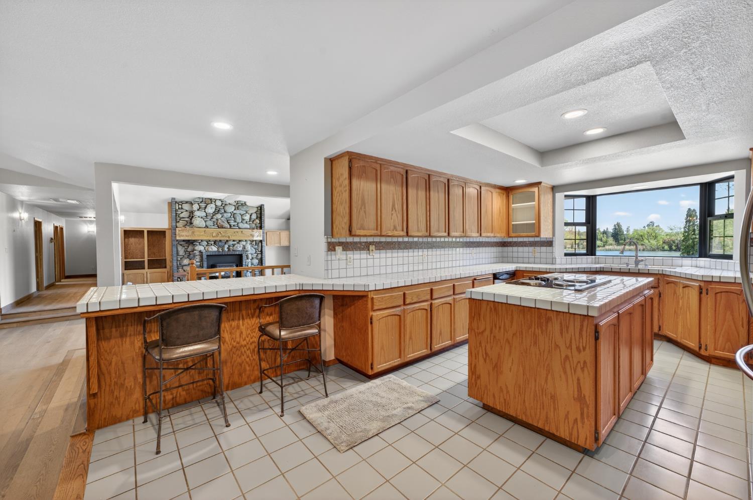 10665 Mt Vernon Road Auburn, CA 95603 - Photo 28 of 45 a kitchen with stainless steel appliances granite countertop a stove a sink dishwasher and a refrigerator