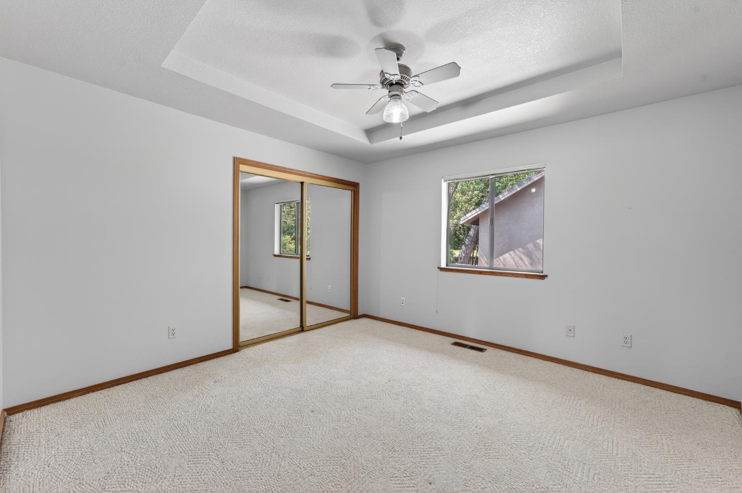10665 Mt Vernon Road Auburn, CA 95603 - Photo 33 of 45 a view of an empty room with chandelier fan
