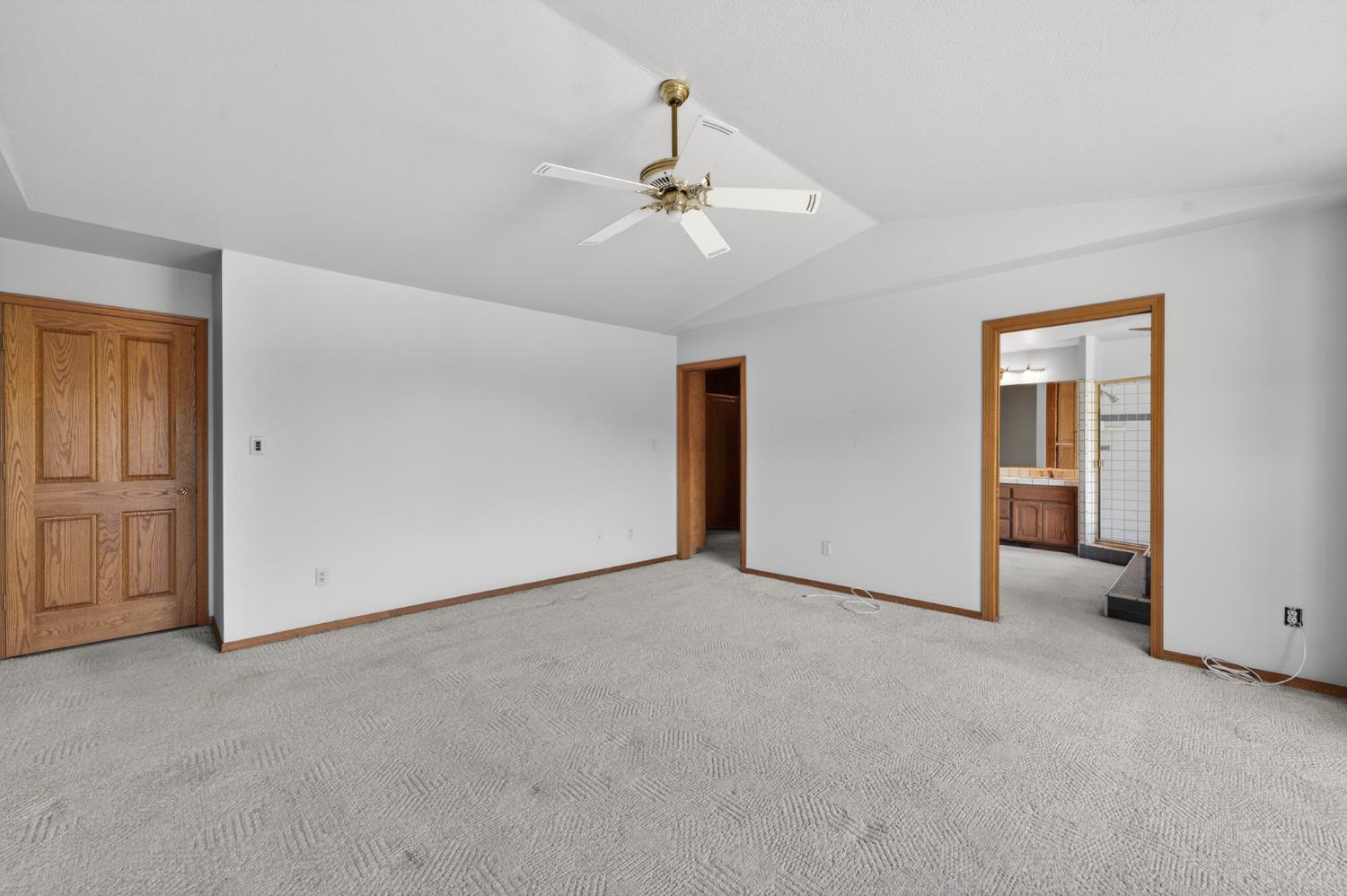 10665 Mt Vernon Road Auburn, CA 95603 - Photo 42 of 45 a view of an empty room with closet and a ceiling fan