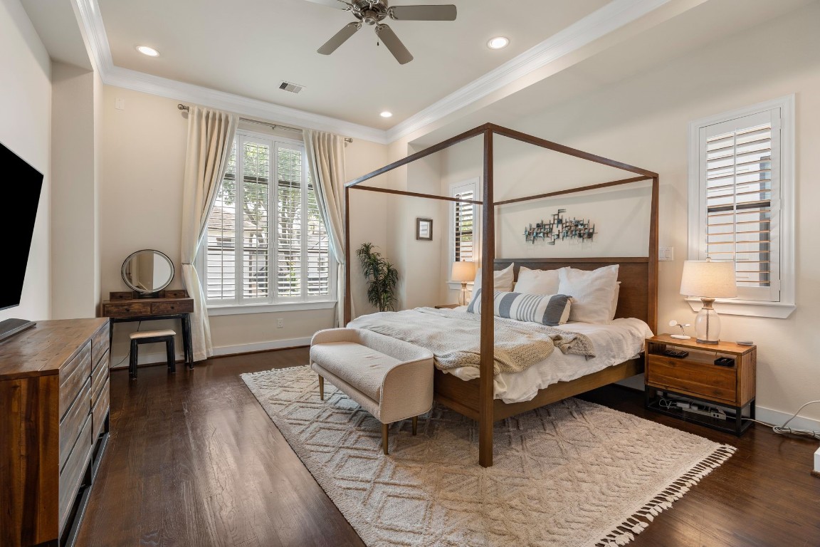 4205 Koehler Street, Unit B Houston, TX 77007 - Photo 13 of 28 a bedroom with a bed and wooden floor
