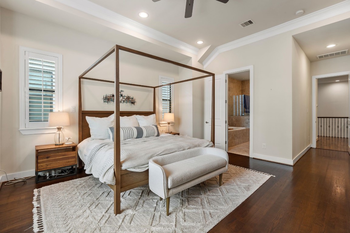 4205 Koehler Street, Unit B Houston, TX 77007 - Photo 14 of 28 a bedroom with a bed and wooden floor