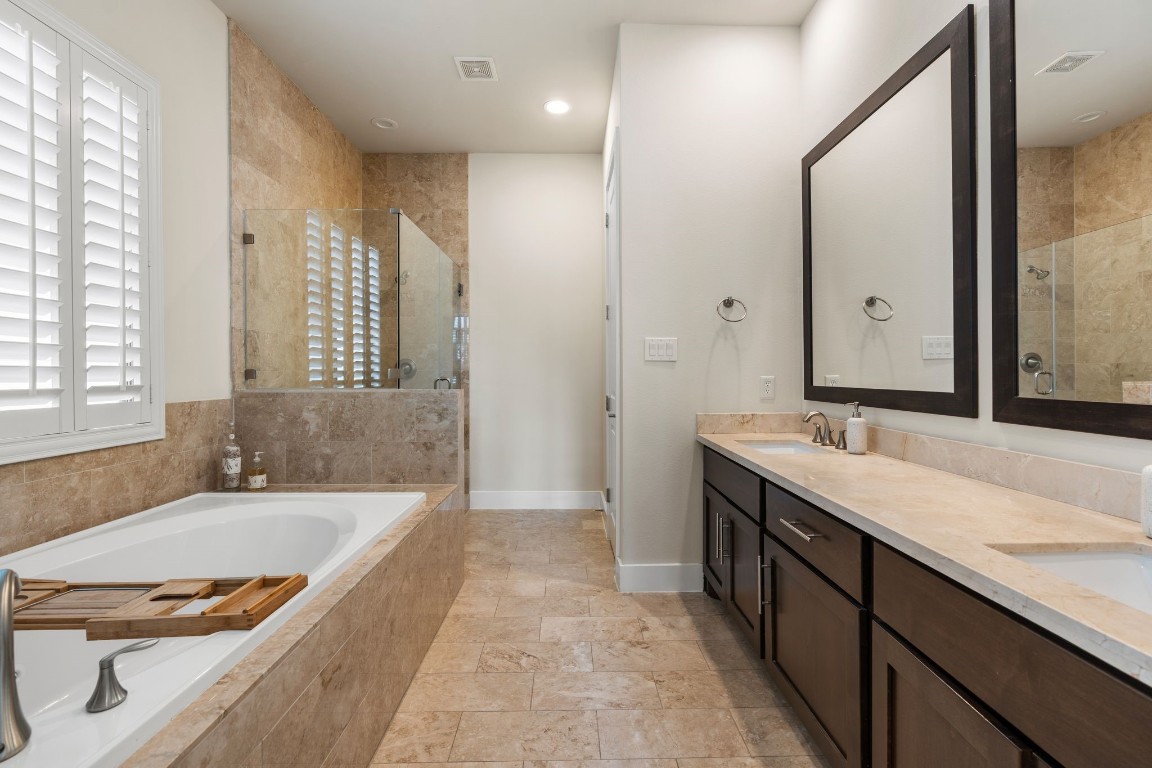 4205 Koehler Street, Unit B Houston, TX 77007 - Photo 15 of 28 a bathroom with a granite countertop tub sink and mirror