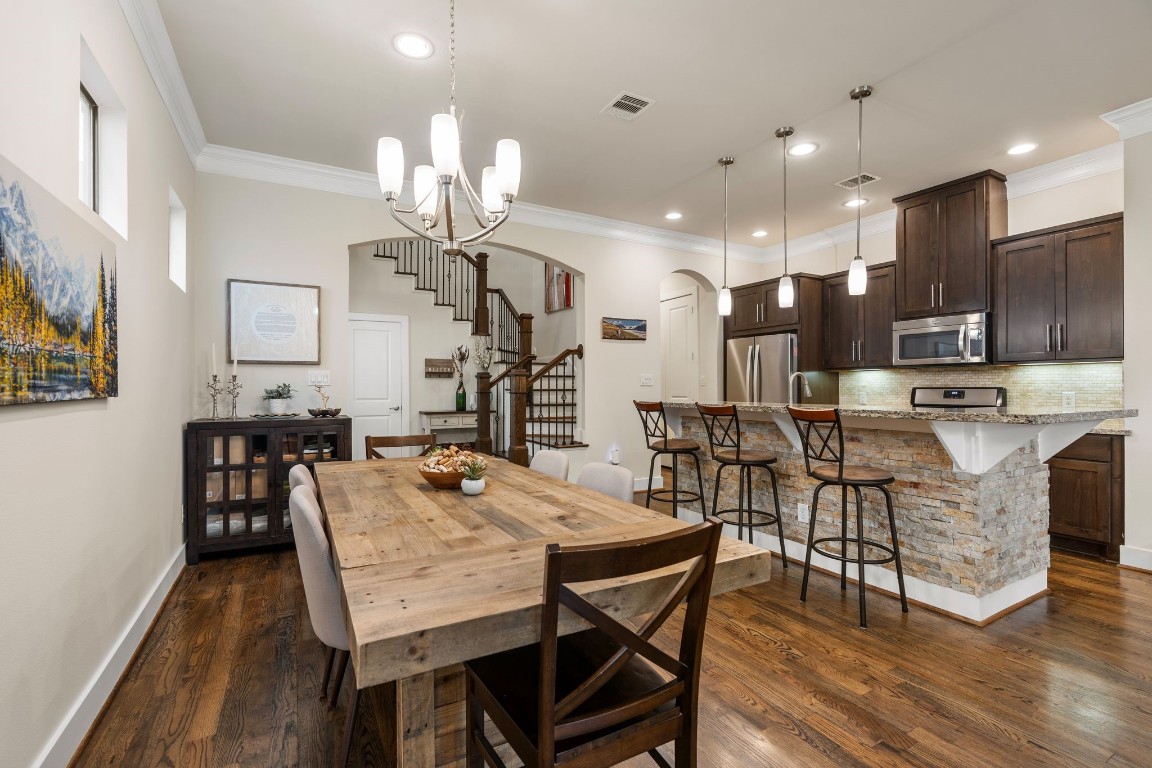 4205 Koehler Street, Unit B Houston, TX 77007 - Photo 8 of 28 a view of a dining room with furniture and wooden floor