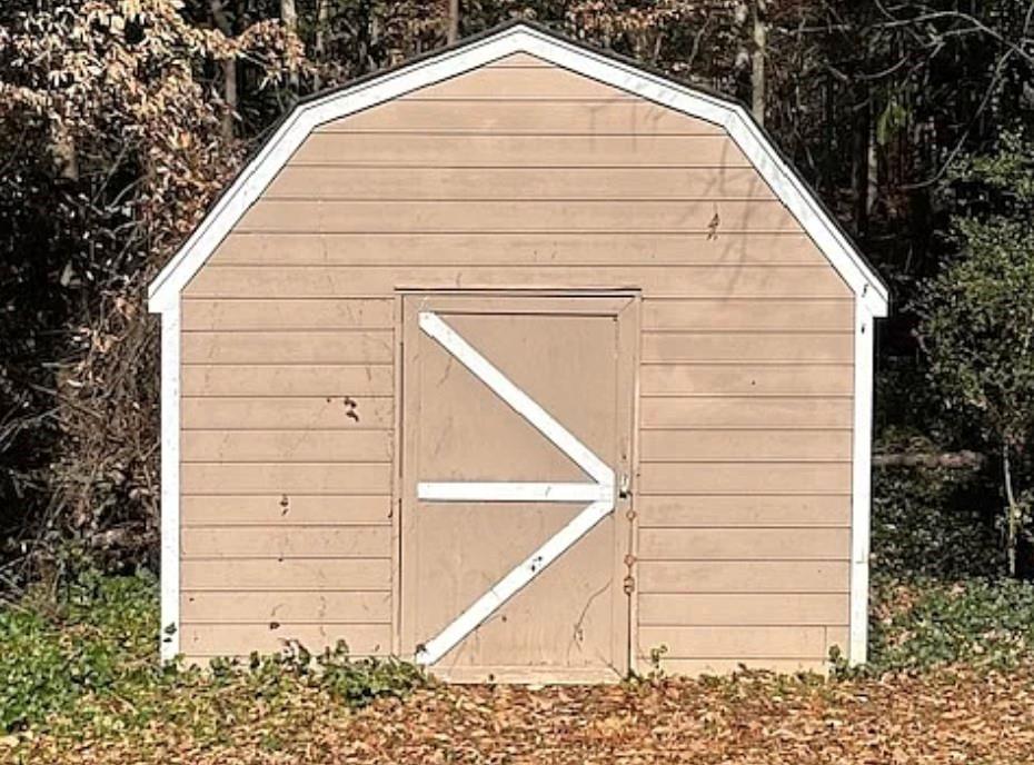 586 Ridge Avenue Mableton, GA 30126 - Photo 2 of 12 a view of wooden house with a small space