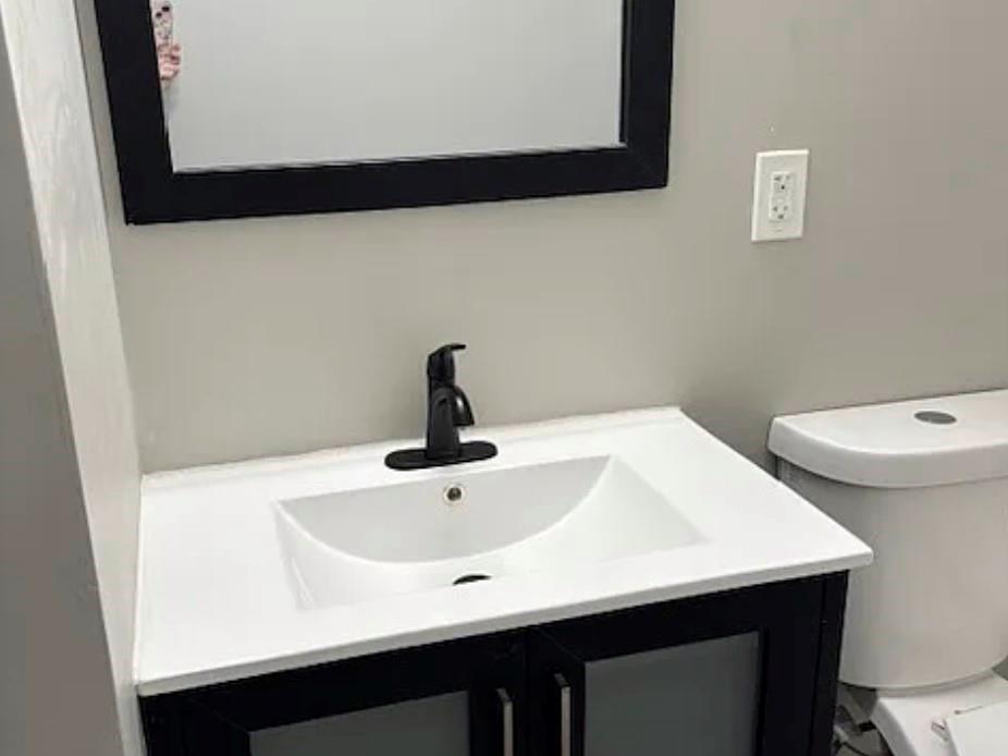 586 Ridge Avenue Mableton, GA 30126 - Photo 4 of 12 a close view of a sink and a stove in a bathroom