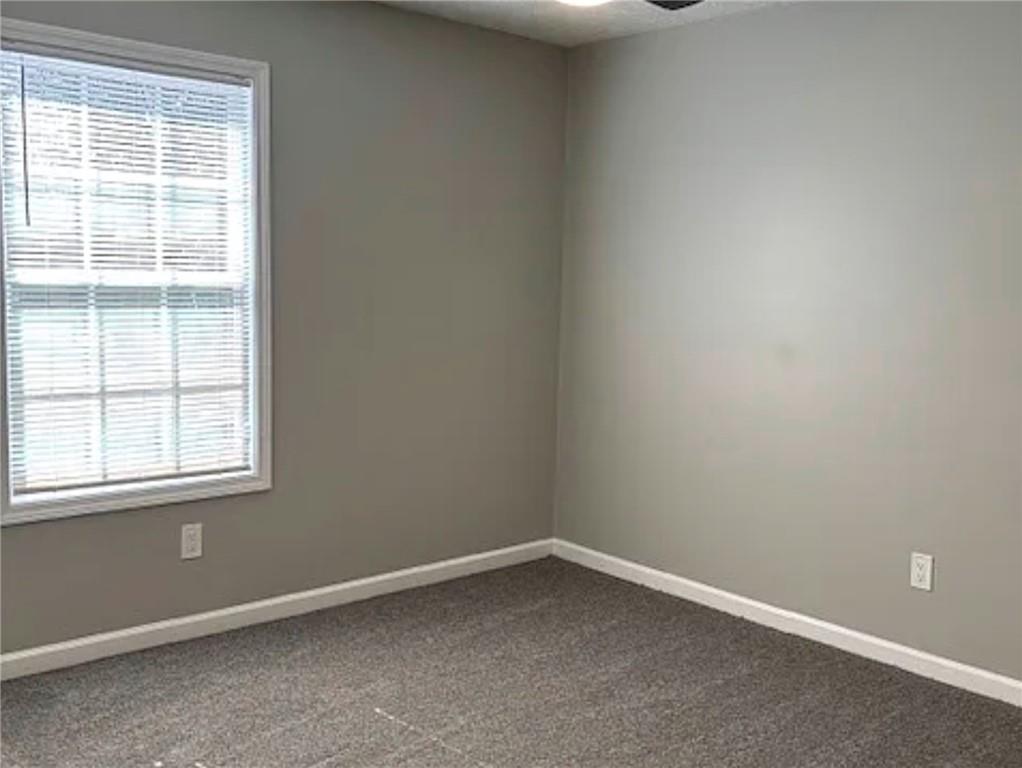586 Ridge Avenue Mableton, GA 30126 - Photo 8 of 12 an empty room with a window