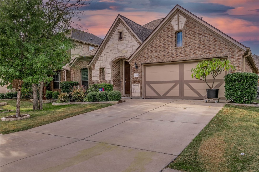 front view of a house with a yard