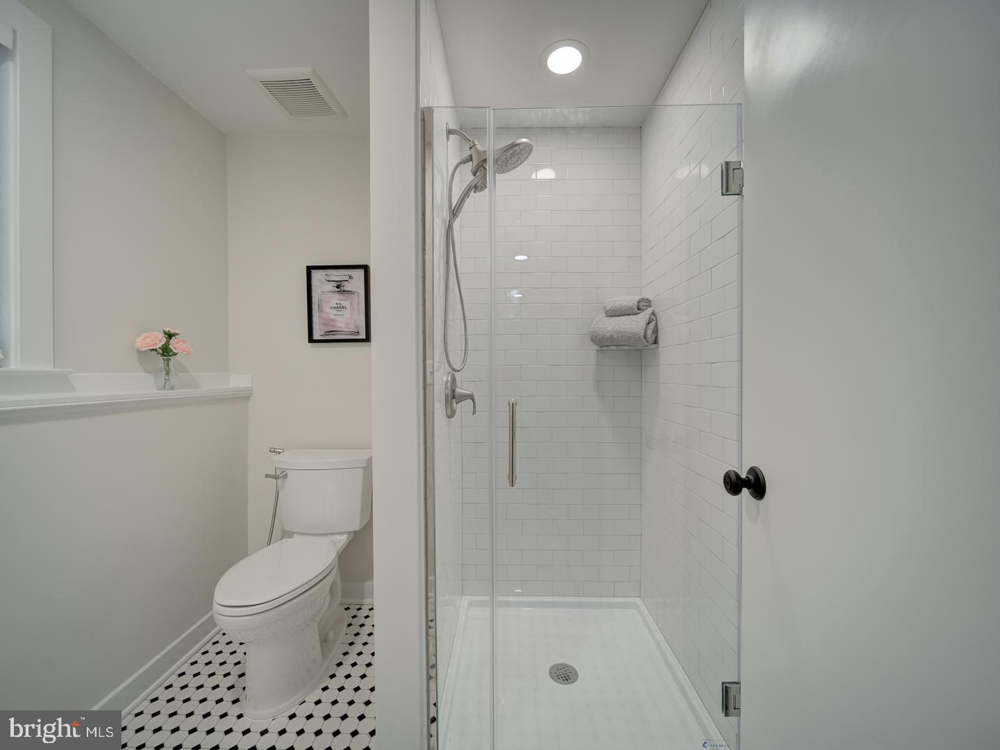 12356 Lima Lane Reston, VA 20191 - Photo 31 of 44 a bathroom with a shower a toilet and sink