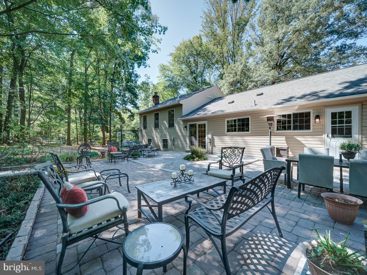 12356 Lima Lane Reston, VA 20191 - Photo 35 of 44 a view of a patio with table and chairs and wooden fence