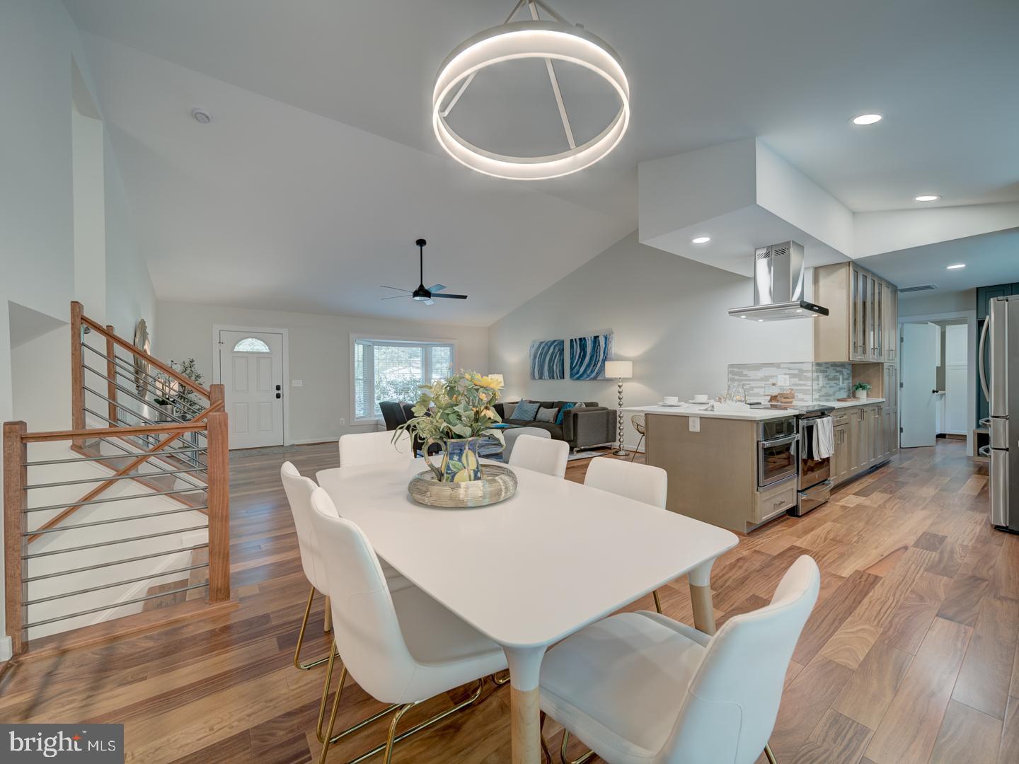12356 Lima Lane Reston, VA 20191 - Photo 6 of 44 a view of a dining room with furniture and wooden floor