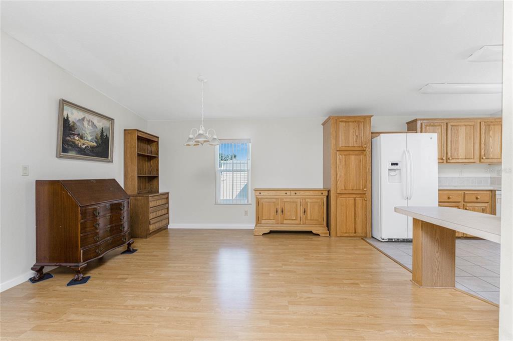 1891 Englewood Road, Unit 81 Englewood, FL 34223 - Photo 20 of 53 a view of a livingroom with furniture and a flat screen tv