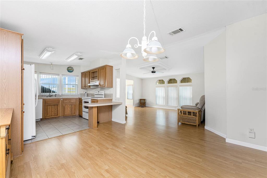 1891 Englewood Road, Unit 81 Englewood, FL 34223 - Photo 22 of 53 a view of kitchen with sink and wooden floor