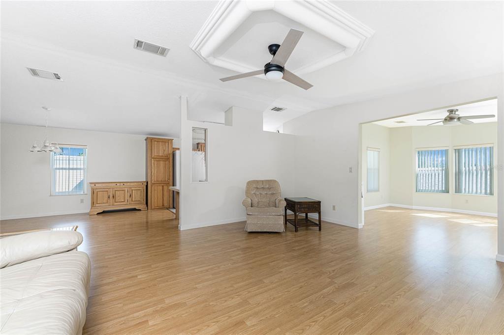 1891 Englewood Road, Unit 81 Englewood, FL 34223 - Photo 23 of 53 a view of a livingroom with furniture and a ceiling fan