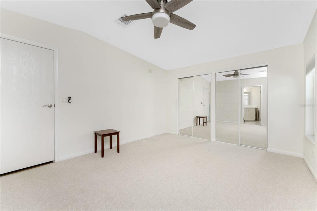 1891 Englewood Road, Unit 81 Englewood, FL 34223 - Photo 24 of 53 a large white bed in a white room