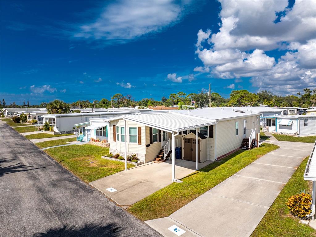 1891 Englewood Road, Unit 81 Englewood, FL 34223 - Photo 3 of 53 a view of a house with a swimming pool