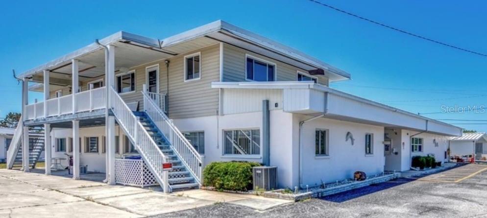 1891 Englewood Road, Unit 81 Englewood, FL 34223 - Photo 39 of 53 a front view of a house with stairs