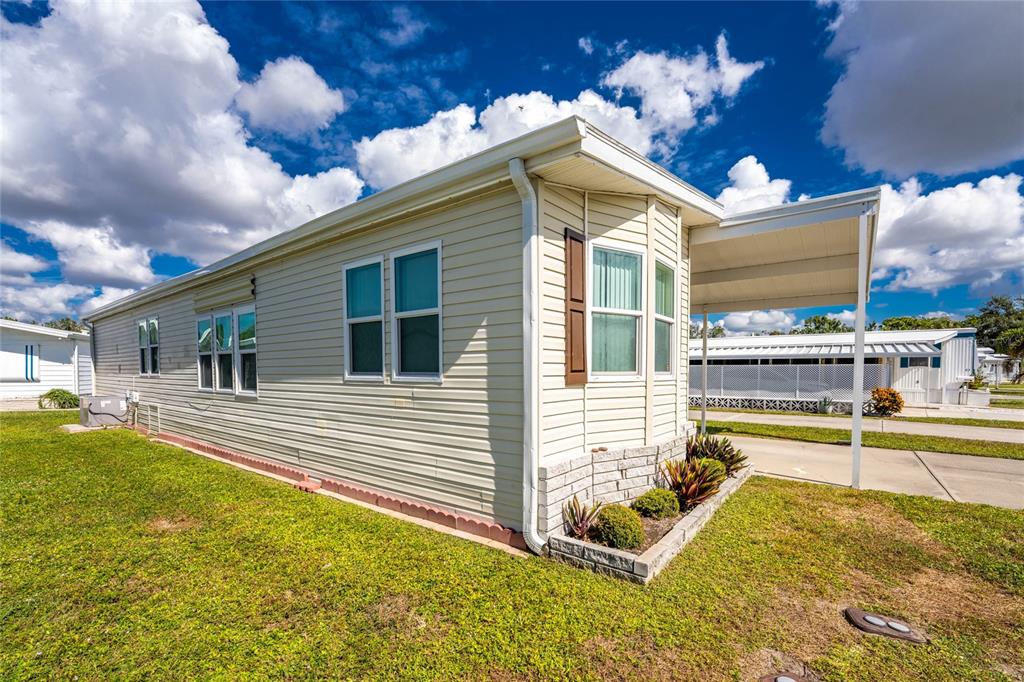 1891 Englewood Road, Unit 81 Englewood, FL 34223 - Photo 4 of 53 a view of a house with swimming pool and sitting area