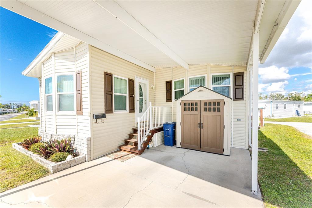 1891 Englewood Road, Unit 81 Englewood, FL 34223 - Photo 53 of 53 a front view of a house with a garden