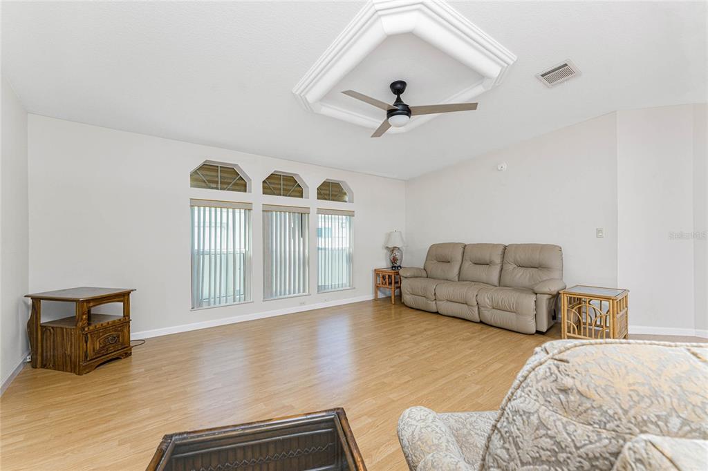 1891 Englewood Road, Unit 81 Englewood, FL 34223 - Photo 9 of 53 a living room with furniture and a window