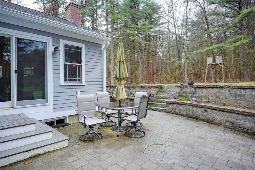 60 Coal Kiln Road Princeton, MA 01541 - Photo 2 of 31 a view of a chairs and table in the back yard of the house
