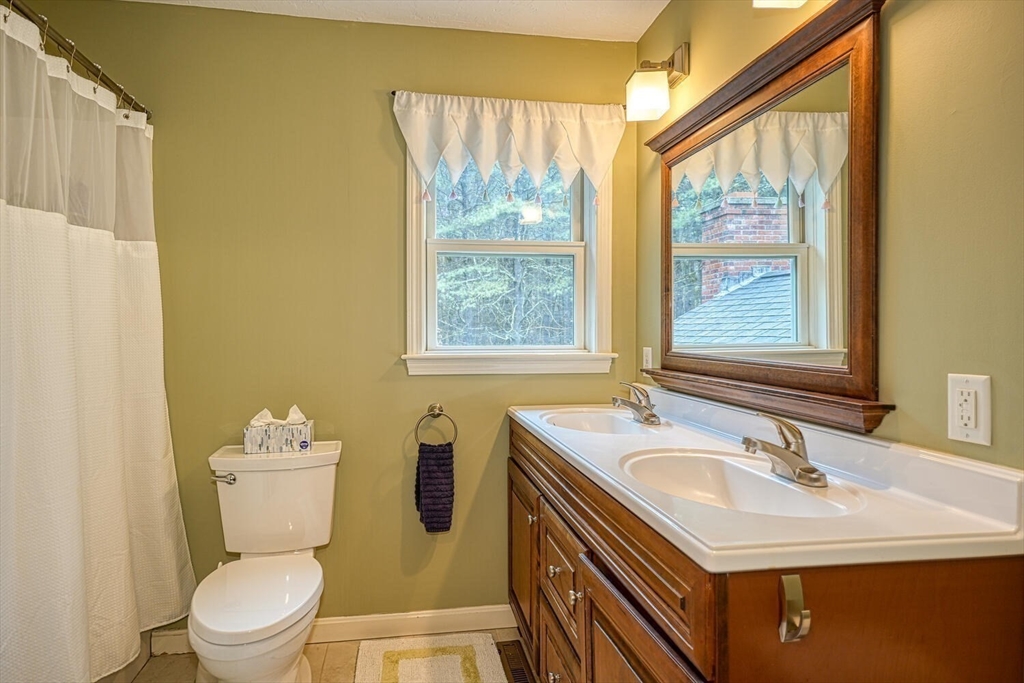 60 Coal Kiln Road Princeton, MA 01541 - Photo 24 of 31 a bathroom with a sink toilet vanity and window