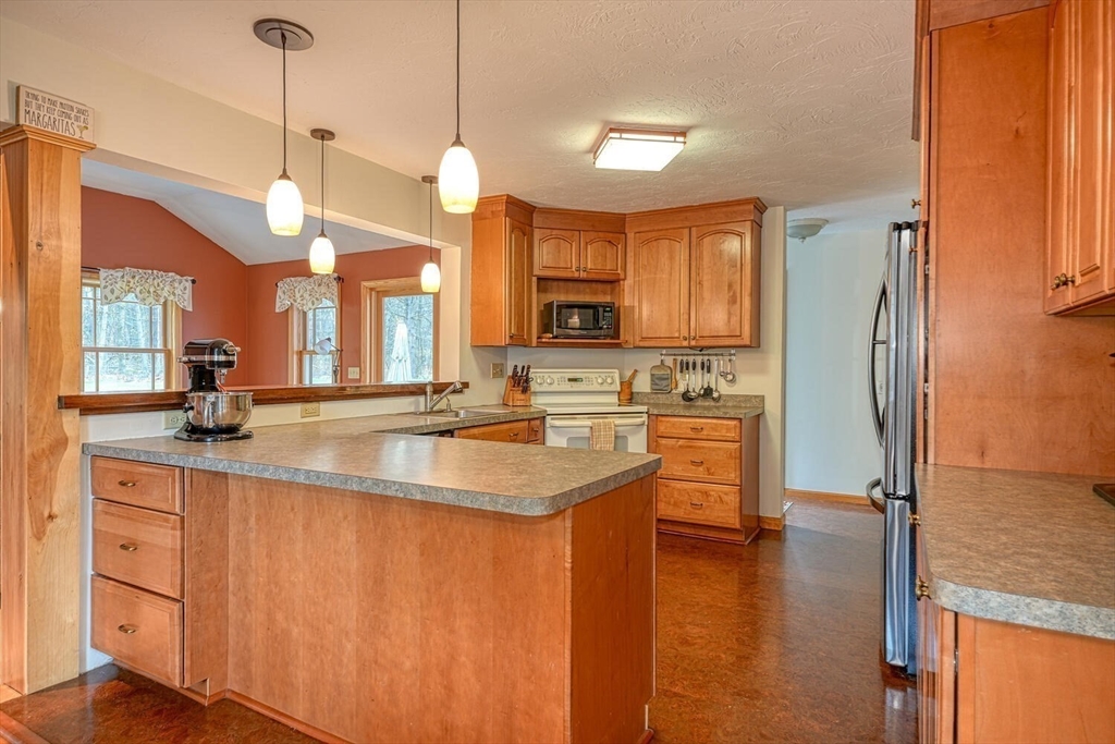 60 Coal Kiln Road Princeton, MA 01541 - Photo 3 of 31 a kitchen with stainless steel appliances granite countertop a sink a stove and a refrigerator