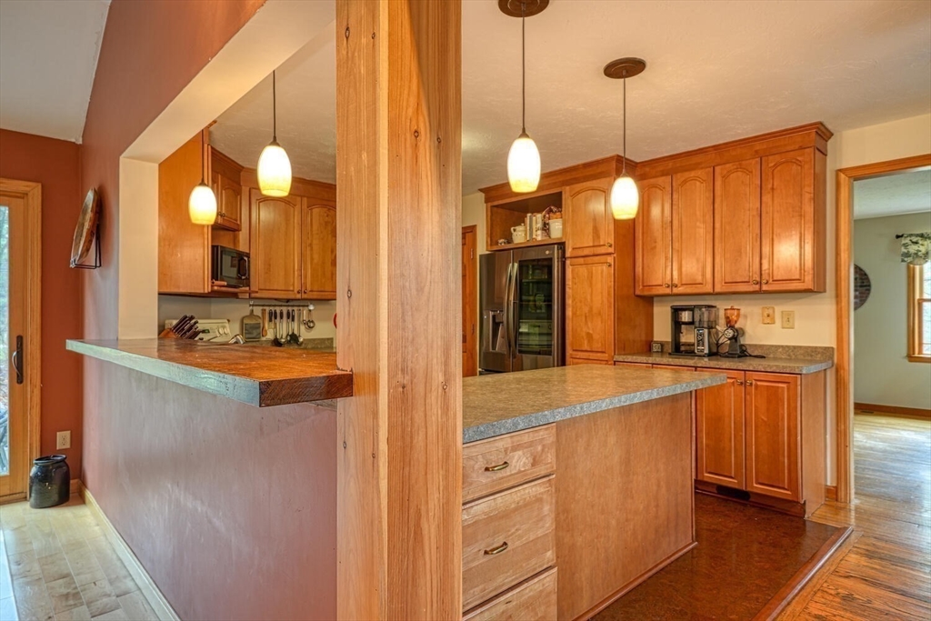 60 Coal Kiln Road Princeton, MA 01541 - Photo 5 of 31 a kitchen with stainless steel appliances granite countertop a sink and a refrigerator
