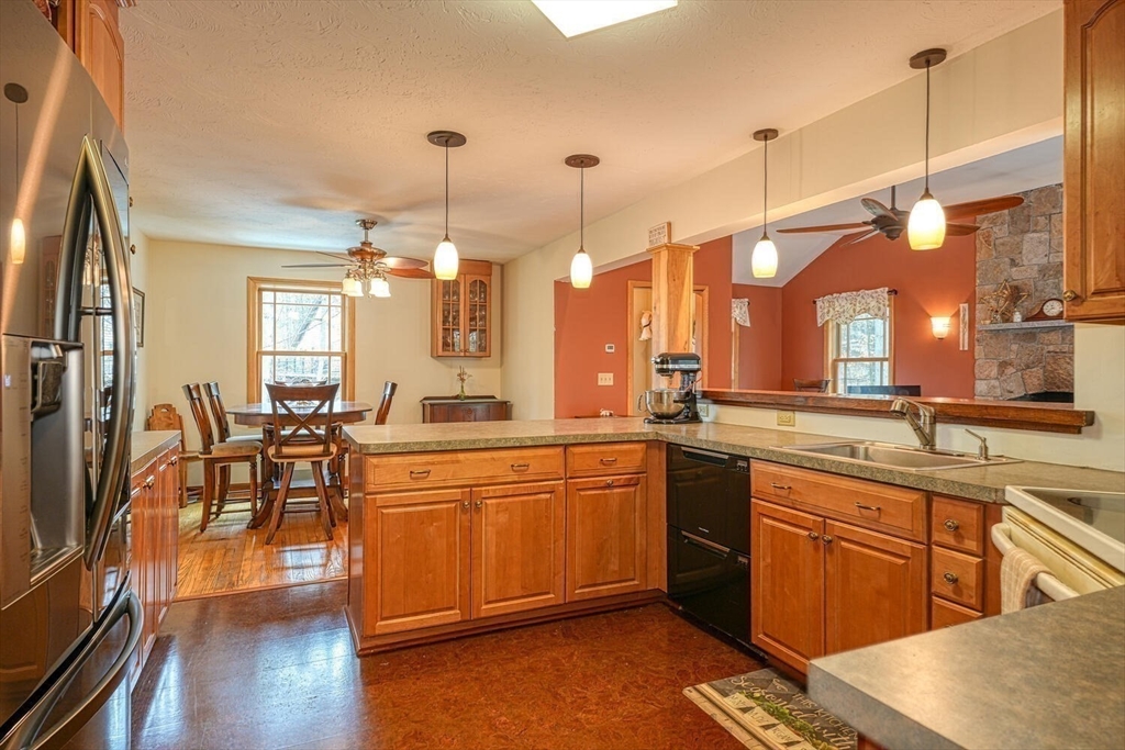 60 Coal Kiln Road Princeton, MA 01541 - Photo 6 of 31 a large kitchen with lots of counter space a sink appliances and dining table