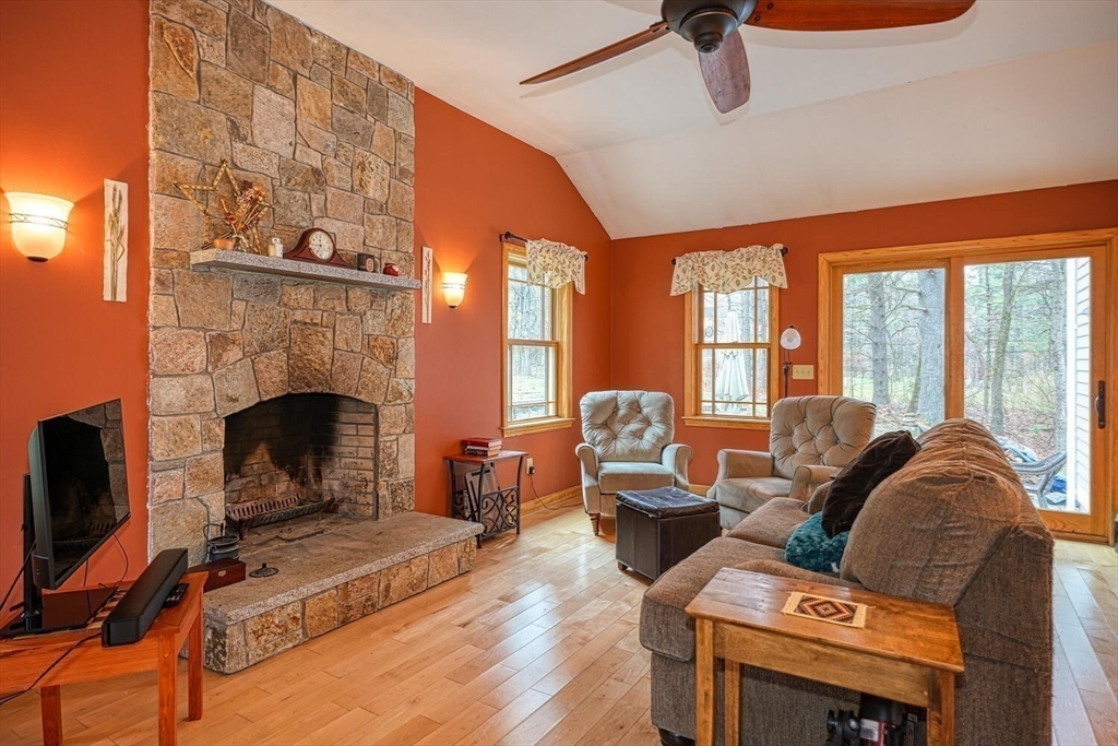 60 Coal Kiln Road Princeton, MA 01541 - Photo 7 of 31 a living room with furniture a flat screen tv and a fireplace